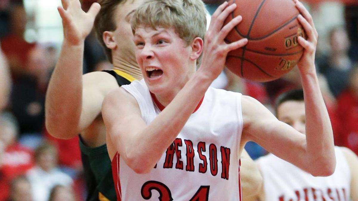 McPherson's Ben Pyle cuts through the lane to score two against Bishop Carroll in the second quarter Friday in McPherson.