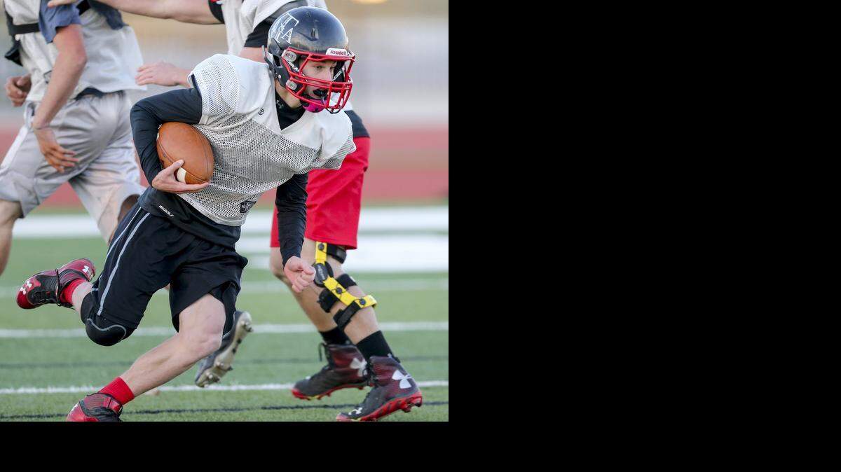
Argonia-Attica QB Alec McDaniel runs for daylight as they practice in Mulvane Thursday. The team was practicing in Mulvane so they could get used to playing on artificial turf, which they will play on in Saturday's Eight-man Division II championship game against Victoria. (Nov. 20, 2014)
