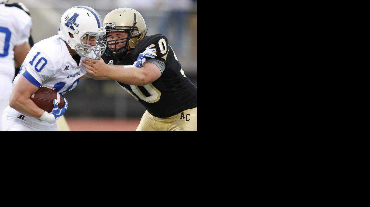 
Andover’s Cole VanEpps, left, runs against Andover Central’s Doug Hoffman during Friday’s game. VannEpps had 127 rushing yards and three touchdowns in the victory.
