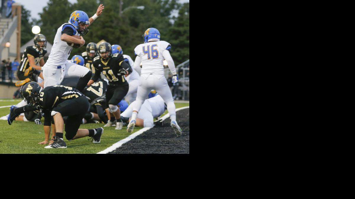
Hutchinson quarterback Canyon Maldonado leaps past a Newton defender in the first quarter for a touchdown during their game in Newton on Friday night.
