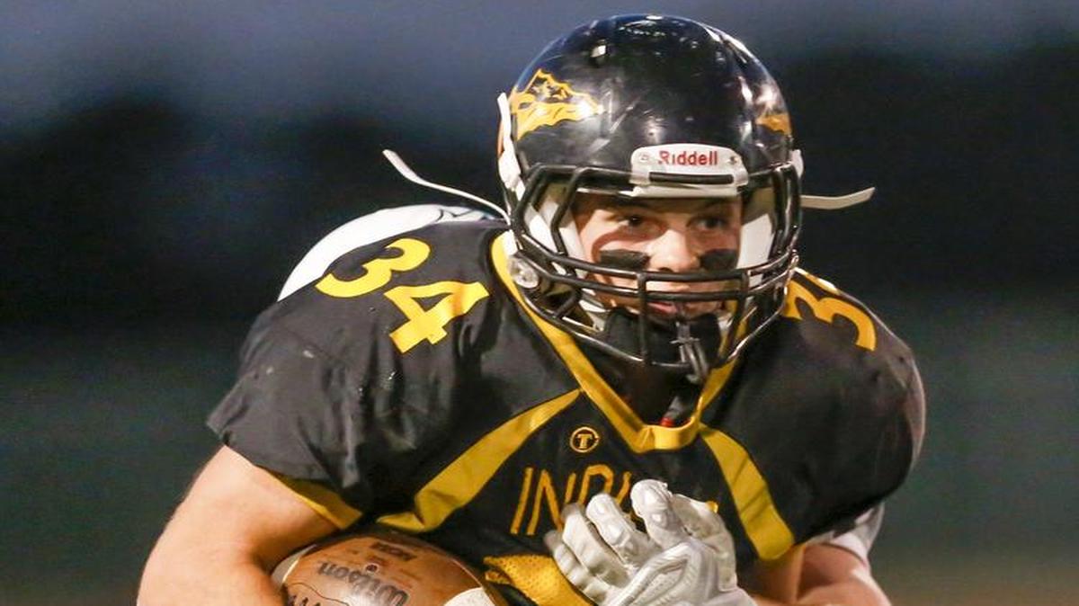 
Andale's Zach Meyer runs for yardage against Trinity in the first quarter Friday at Andale.
