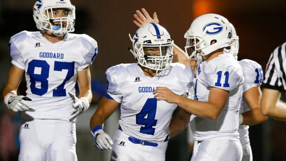 Goddard's Kody Gonzalez (4) is congratulated by QB Blake Sullivan after his long TD run against Valley Center on Oct. 14.