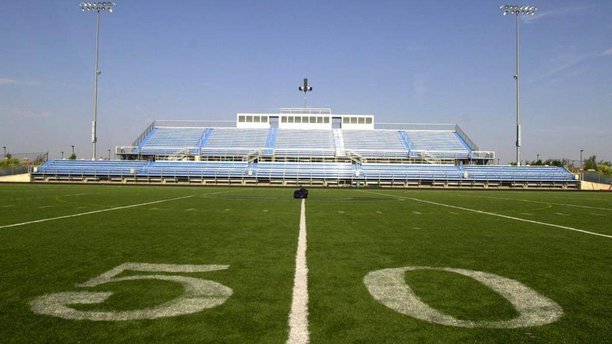 A high school football official has filed a police report and wants to press charges after he says he was punched in the stomach by a Goddard player as the Lions’ Class 5A playoff game with visiting Heights ended Friday night.