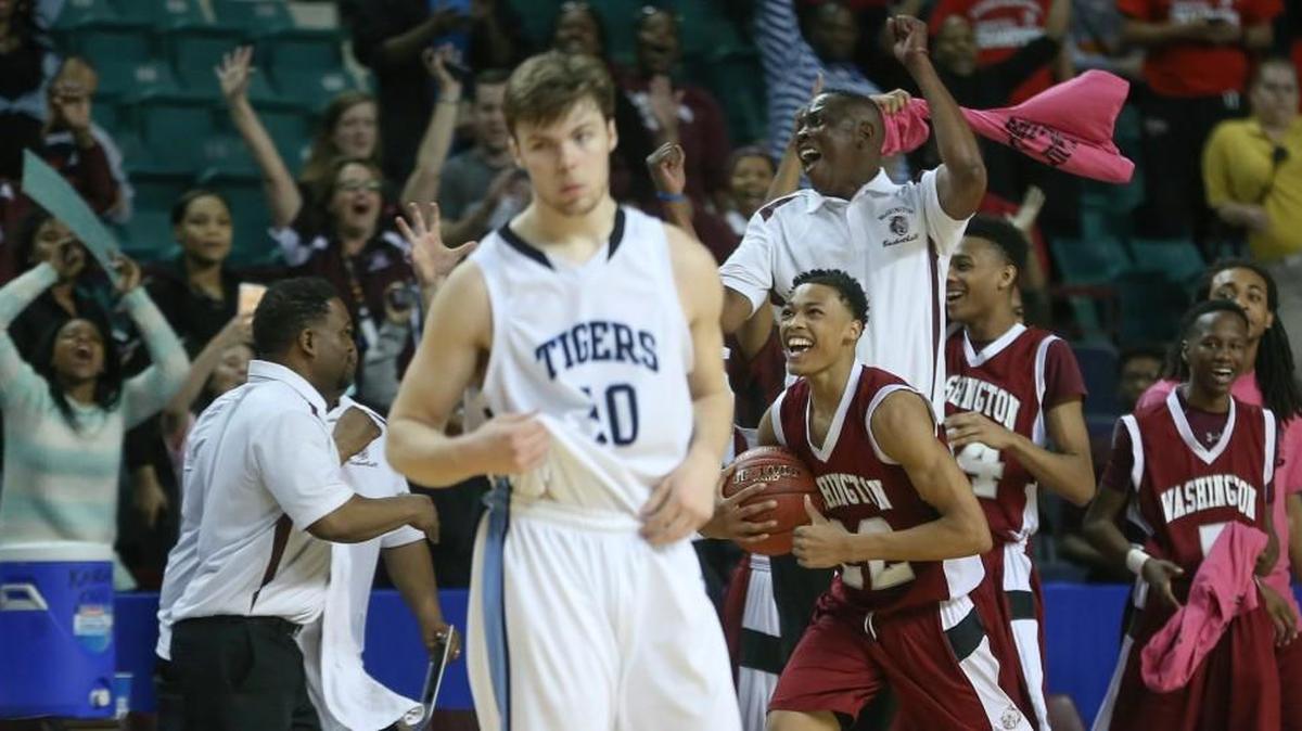 Eisenhower's Matthew Pile leaves the court after the Tigers lost to Kansas City Washington in the Class 5A quarterfinals Wednesday.