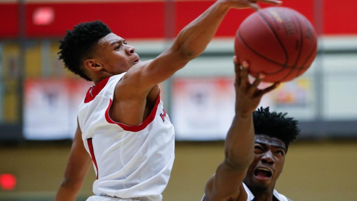 Southeast’s Israel Barnes puts up a shot against a Heights defender earlier this season.
