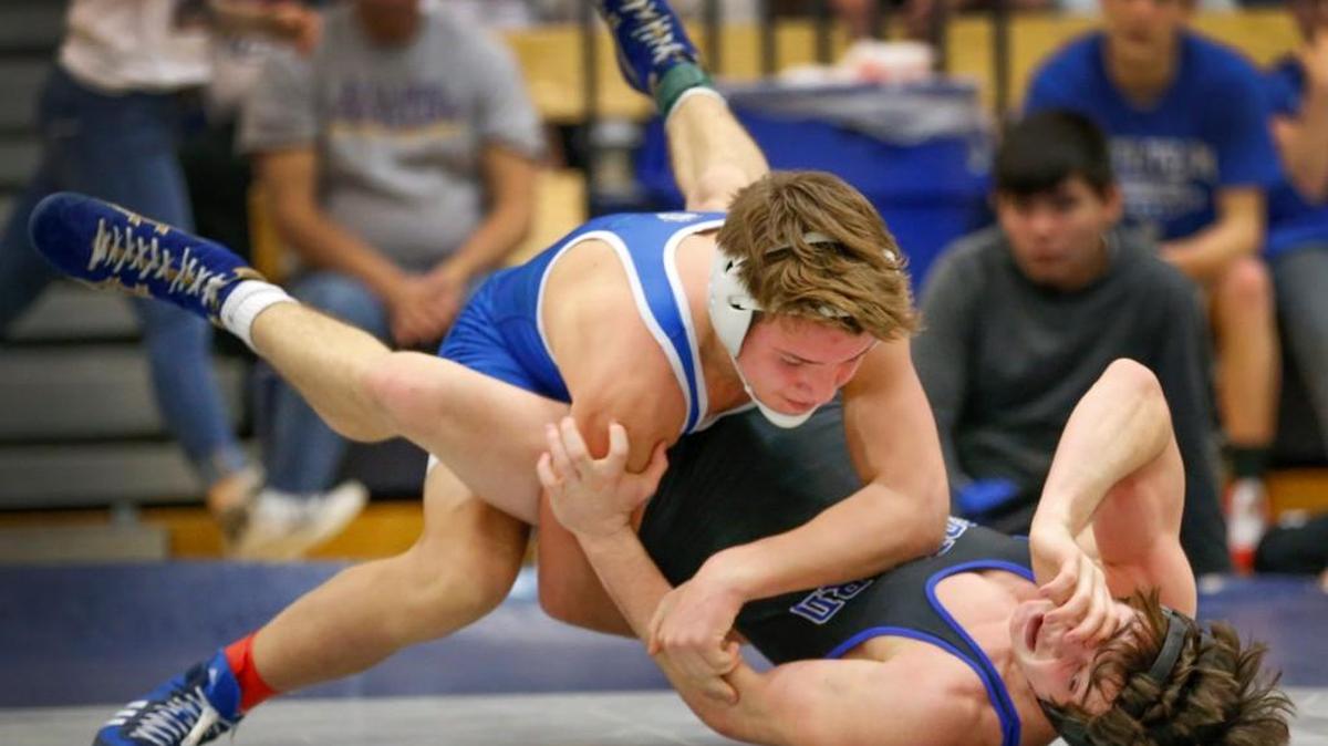 Kapaun's Adam Ayala, top.