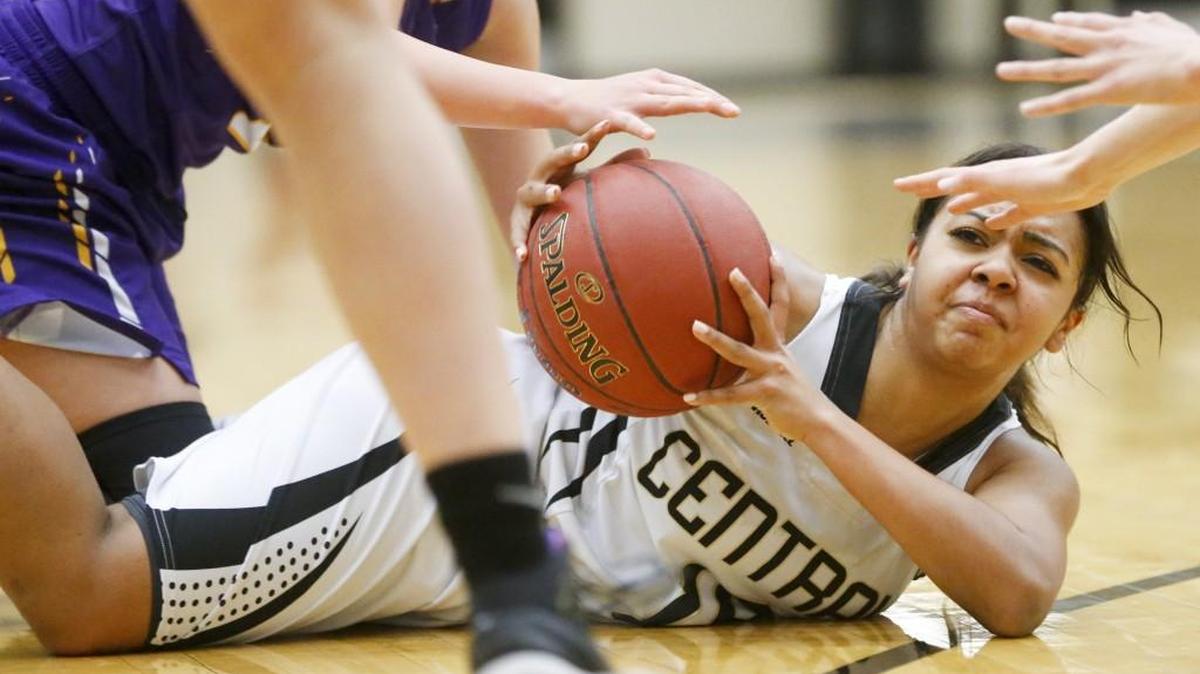 Andover Central's Alyssa Wesley manages to get a pass off after fighting for a loose ball against Valley Center in the fourth quarter.