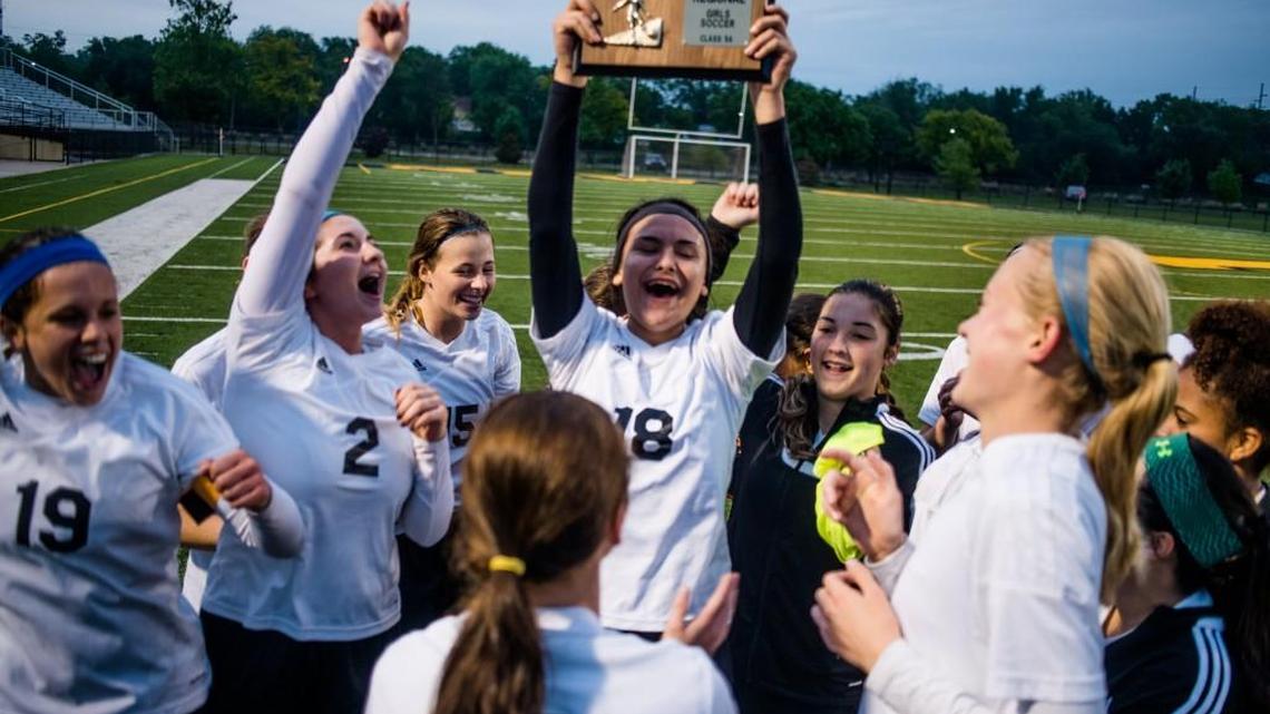 Newton players celebrate after winning a Class 5A girls soccer regional final Thursday.