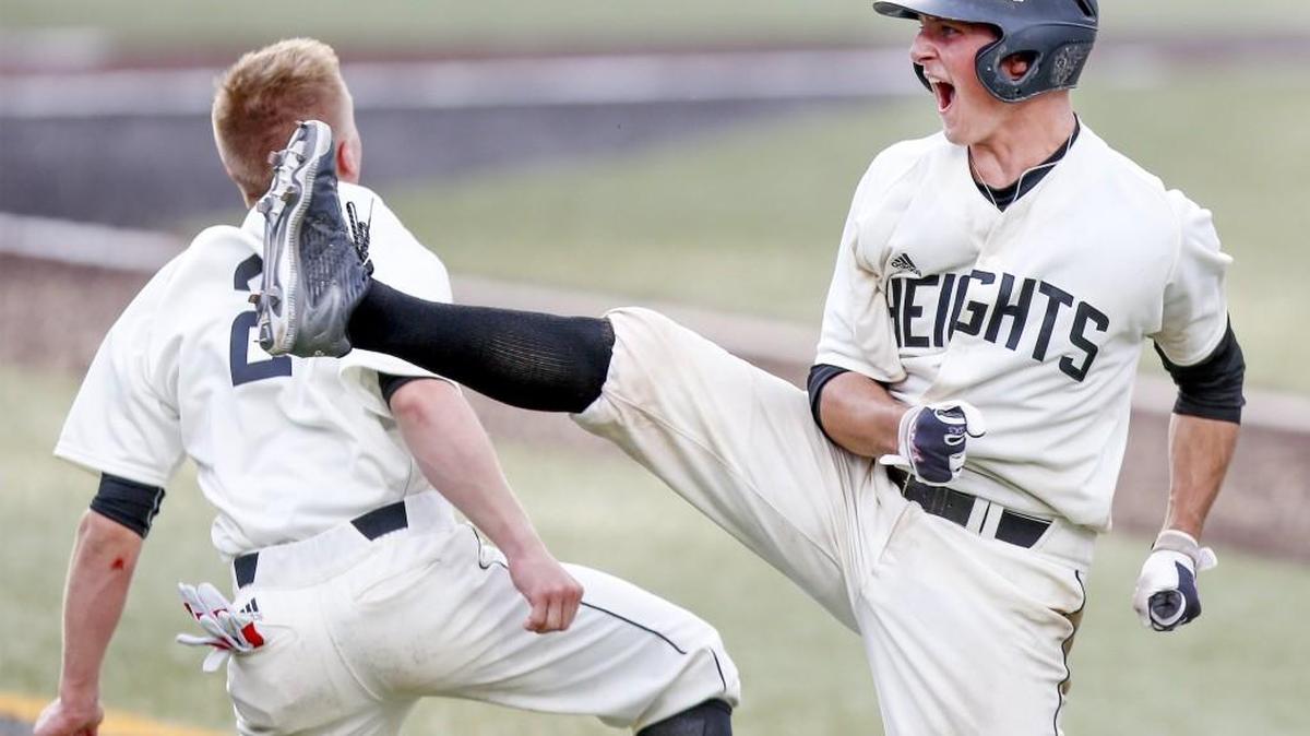 Heights’ Holden Hunsinger, right, celebrates with Bryce Boomsma, left, after getting the game-winning hit against Salina South on Thursday at Eck Stadium.