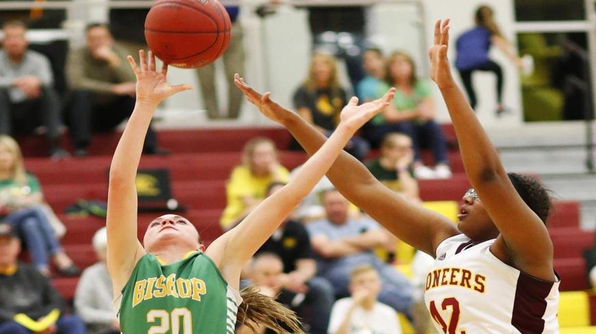 Carroll's Brynn Maul, left, scores as West's Mikayla Shaw defends in the fourth quarter Thursday night.