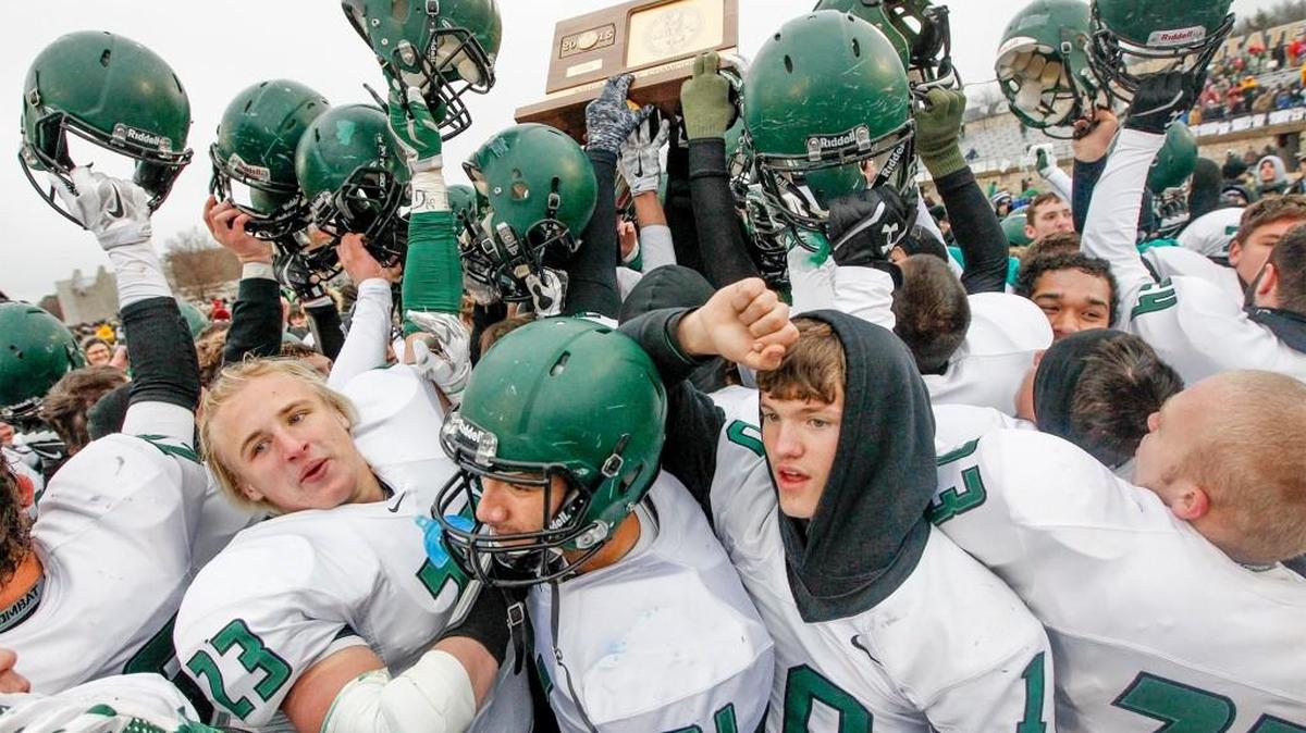 The Derby Panthers hold up the 6A trophy after their 27-14 victory over Blue Valley last November. The teams meet in a rematch Saturday in Emporia.