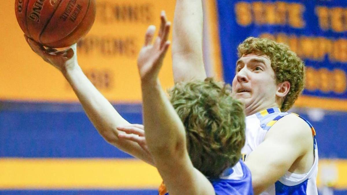 Collegiate’s Kendall Reed puts up a shot against Circle’s Cody Eastridge.