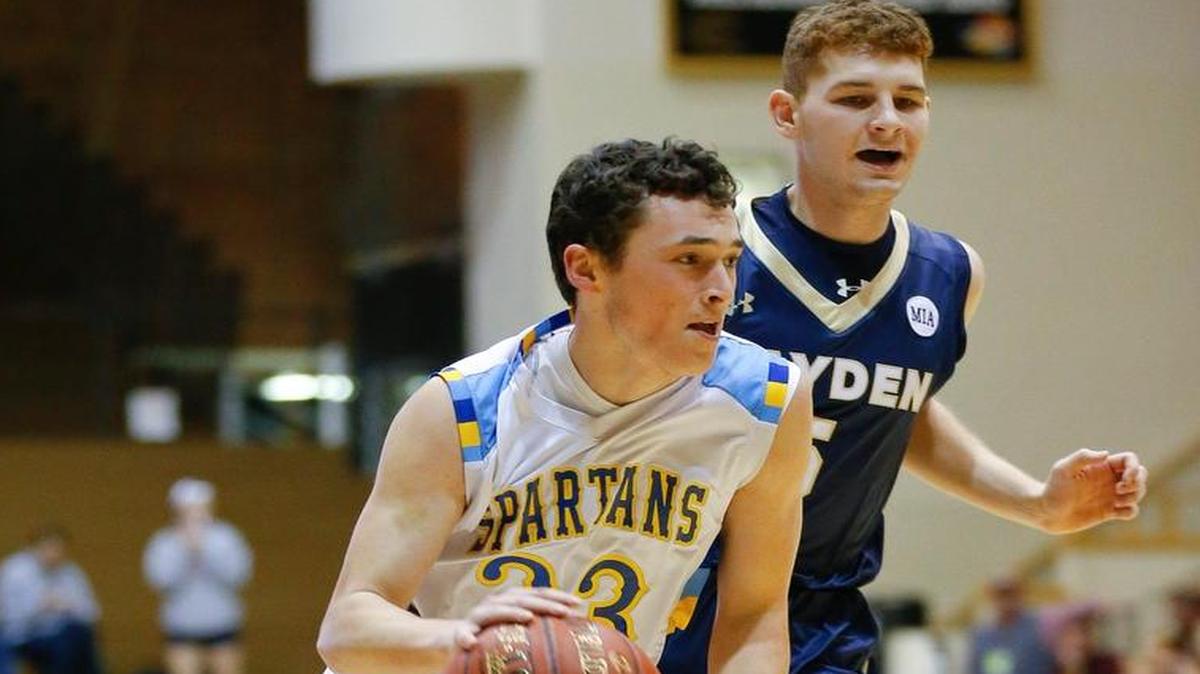 Collegiate's Riley Dick, left, drives past Hayden's Jett Canfield during the first half of Saturday's 4A Division II third place game in Emporia.