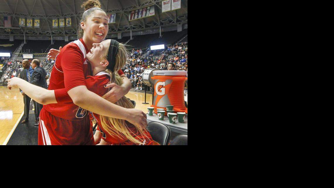
South's Kendrian Elliott, left, and Ericka Mattingly celebrate after defeating Maize 56-48 at the 6A Girls State Championship on Saturday at Koch Arena.
