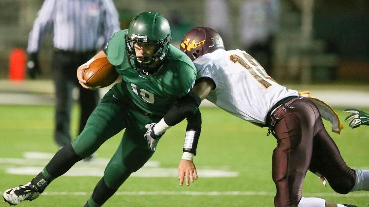 Derby’s Dan Dawdy played as a backup quarterback for the Panthers as a sophomore. Here he carries against West.