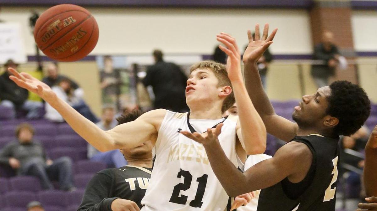 Maize South's Kael Kordonowy, left, rebounds against KC Turner's Reneaux Jackson in the fourth quarter Thursday in Valley Center.
