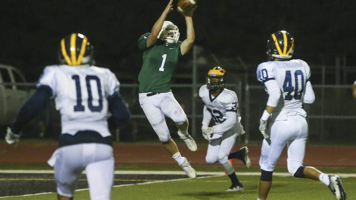 Derby's Brody Kooser catches a touchdown pass against Northwest during the first quarter Friday night.