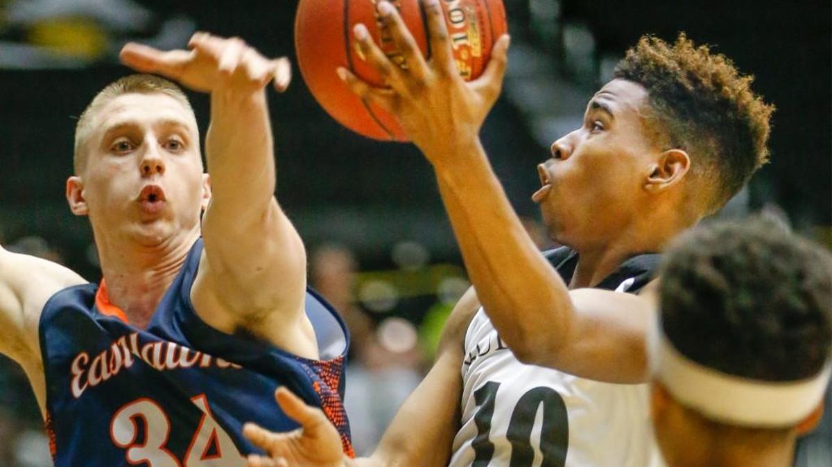 Southeast's Jerrick Harding, right, a first-team All-State pick, goes to the basket against Olathe East's Josiah Talbert, a third-team All-State pick.
