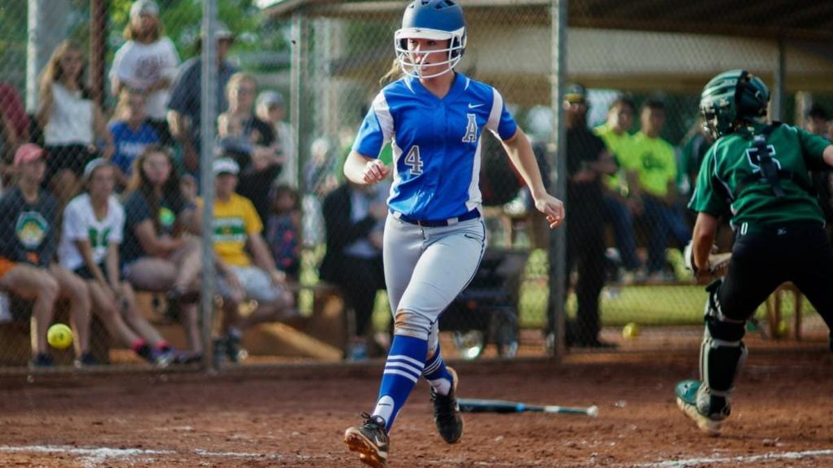 Andover’s Whitney Way scores on a triple hit by Alexa Lesperance against Carroll in the fifth inning Thursday at Two Rivers Youth Club. Andover’s win ended Carroll’s run of five straight Class 5A championships.