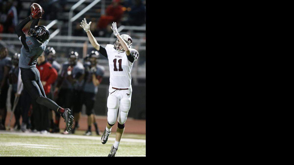 
Heights’ D'Aunte McPhaul, left, intercepts a Salina Central pass intended for Travis Bigler in closing seconds of Friday’s matchup. The interception ended Salina Central's drive and hopes for a win.
