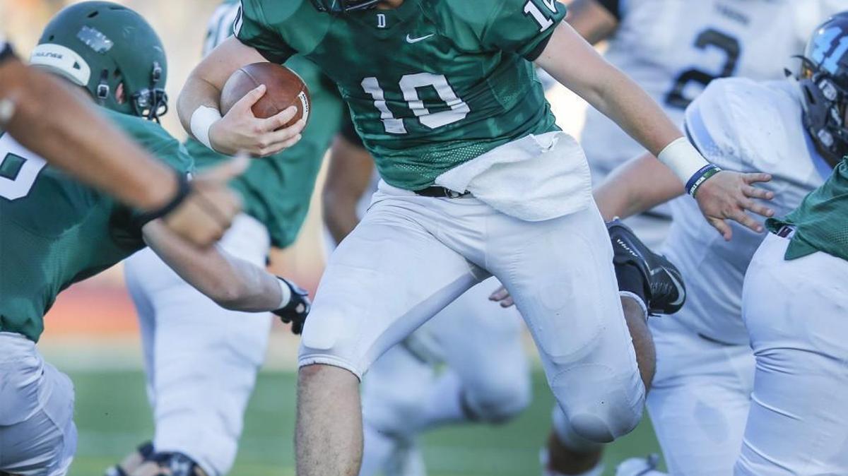 Derby quarterback Dan Dawdy runs in for a touchdown against Eisenhower in the first quarter at Derby High.
