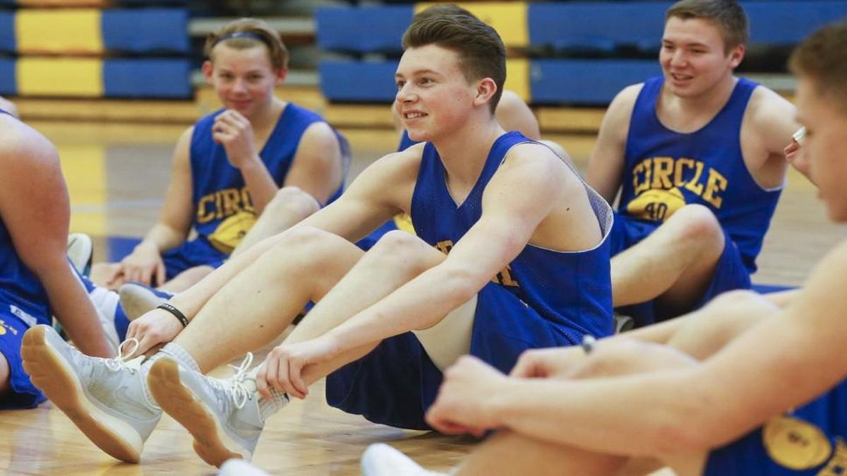 Circle senior Cal Hartley, center, gathers with his team before practice Wednesday in Towanda. Hartley is averaging 25 points to lead the Thunderbirds.