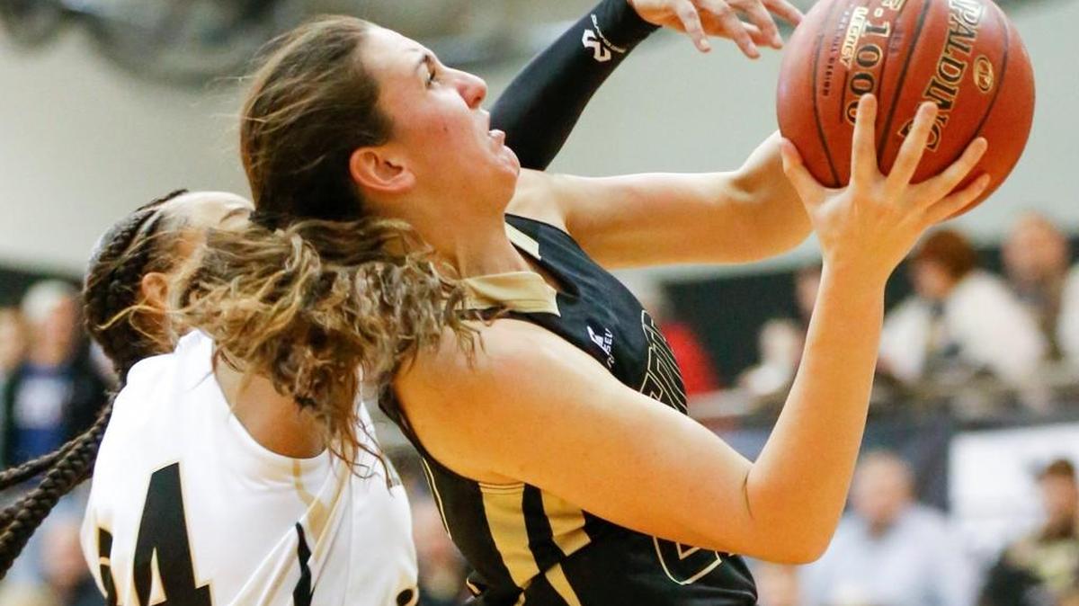 Andover Central's Amanda Kokoulias, right, drives to the basket against Maize South's Jaelynn McLaurian on Jan. 5.