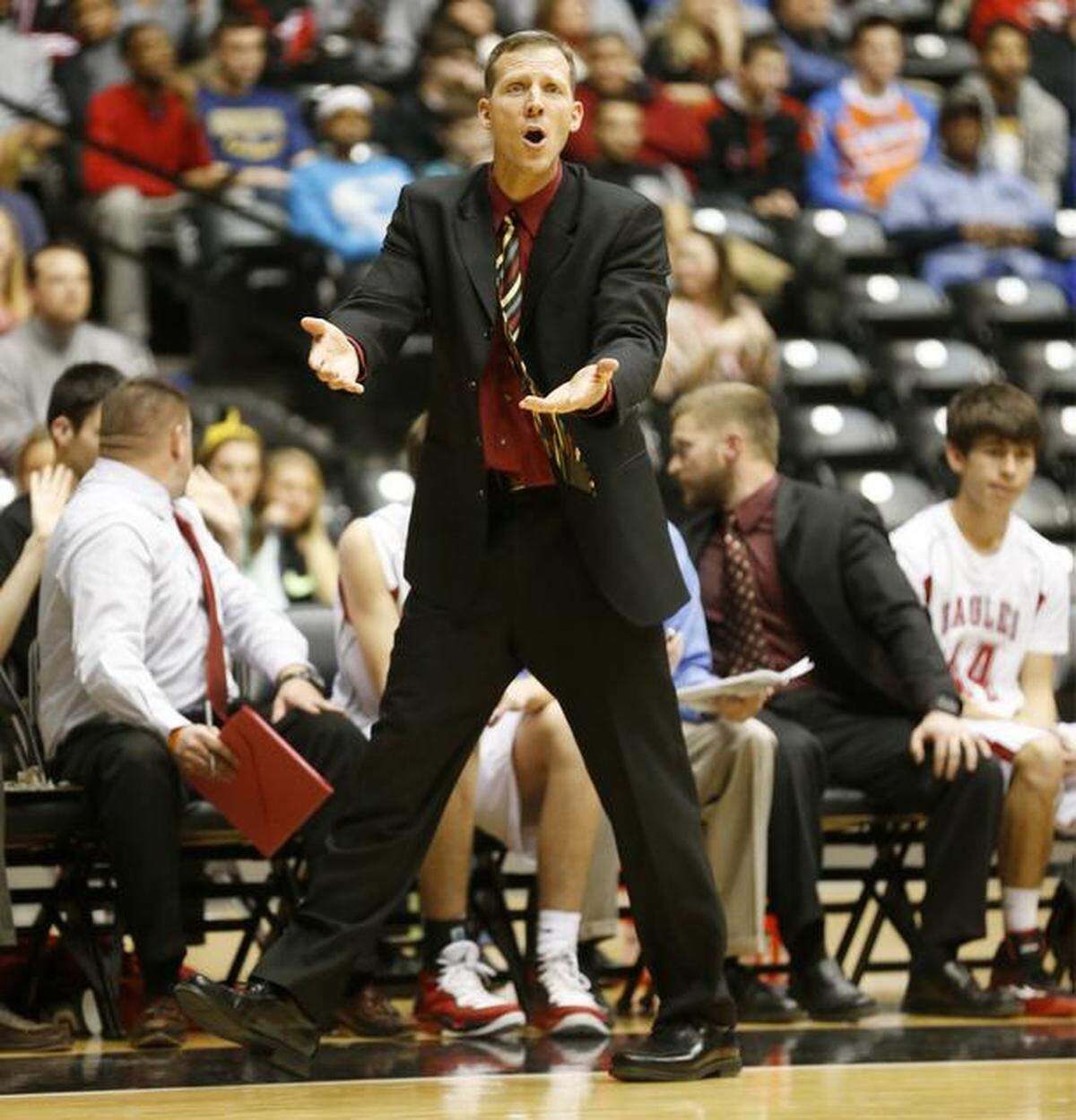 Maize coach Chris Grill pleads with the refs during the fourth quarter against Bishop Carroll during the WATC Basketball Challenge at Koch Arena Friday. Maize won 59-51. (Jan.9, 2015)