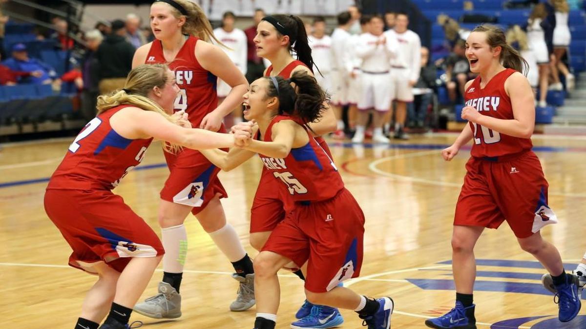 Cheney players Emily Monson and Miranda Ortiz celebrate the 54-43 win over Thomas More Prep on Friday night in Hutchinson.