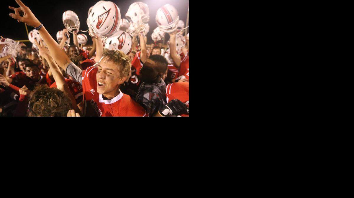 
Maize quarterback Connor Lungwitz celebrates with fans and teammates after Maize defeated Derby 20-13 in Friday’s season opener at Maize. The victory gives the Eagles an early head start in AV-CTL Division I.
