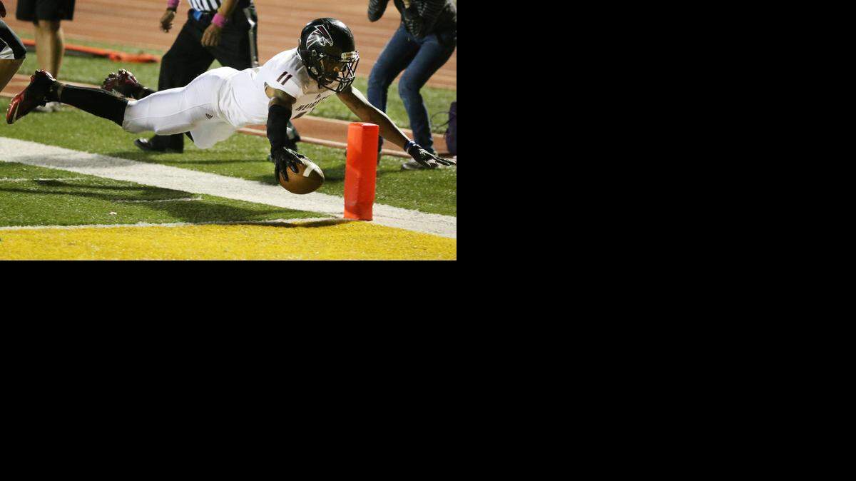 
Heights’ Tre King dives for a touchdown in the first quarter Friday night at Emporia.
