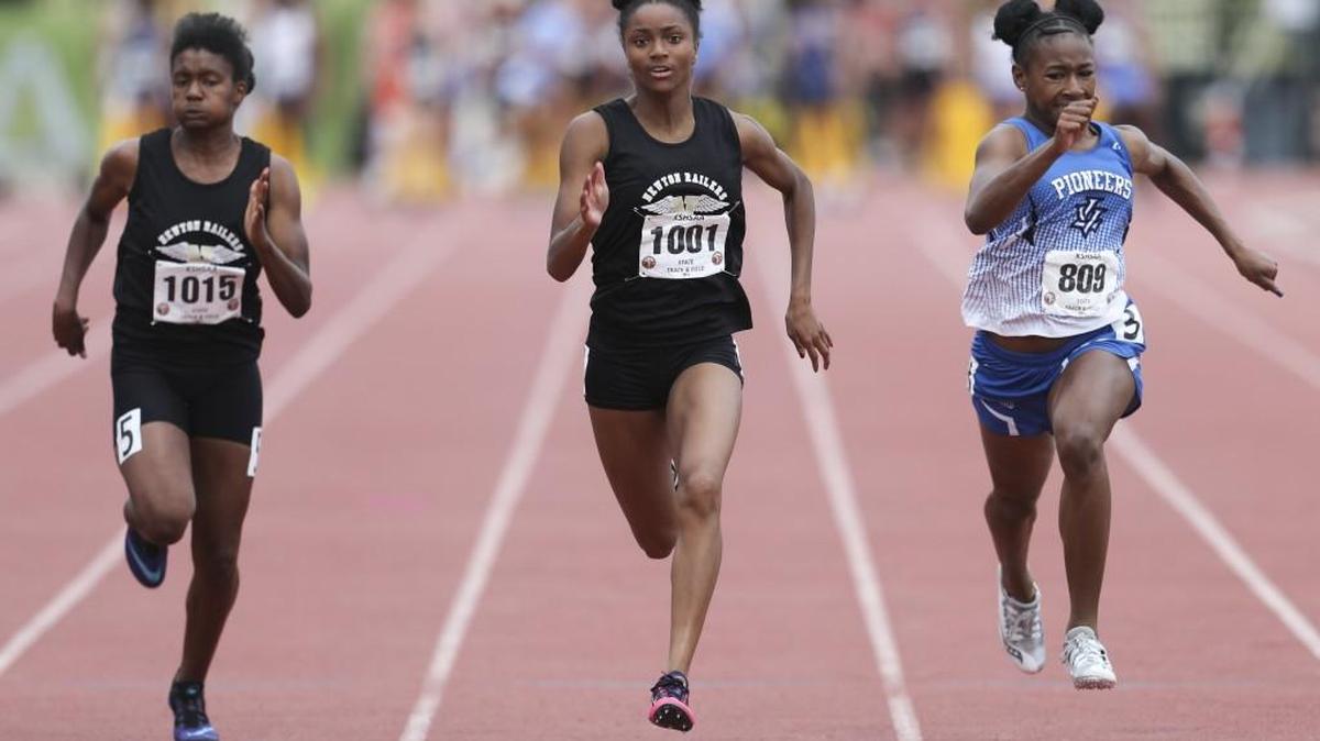 Maize's Savannah Simmons, left, and Kalli Anderson, center, and Leavenworth's Aarika Lister run in the 5A 100 meters. Anderson won in 12.09 seconds.