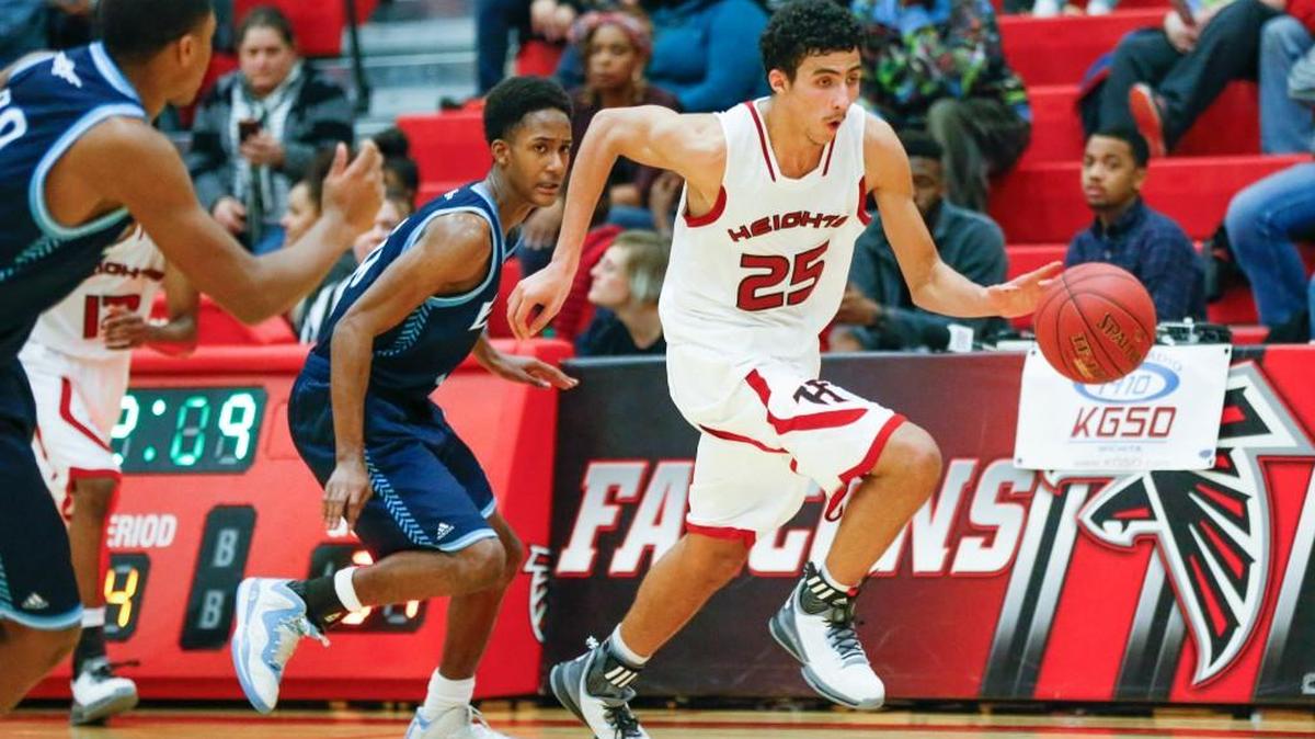 Heights’ Davon Gill dribbles against East last Friday.