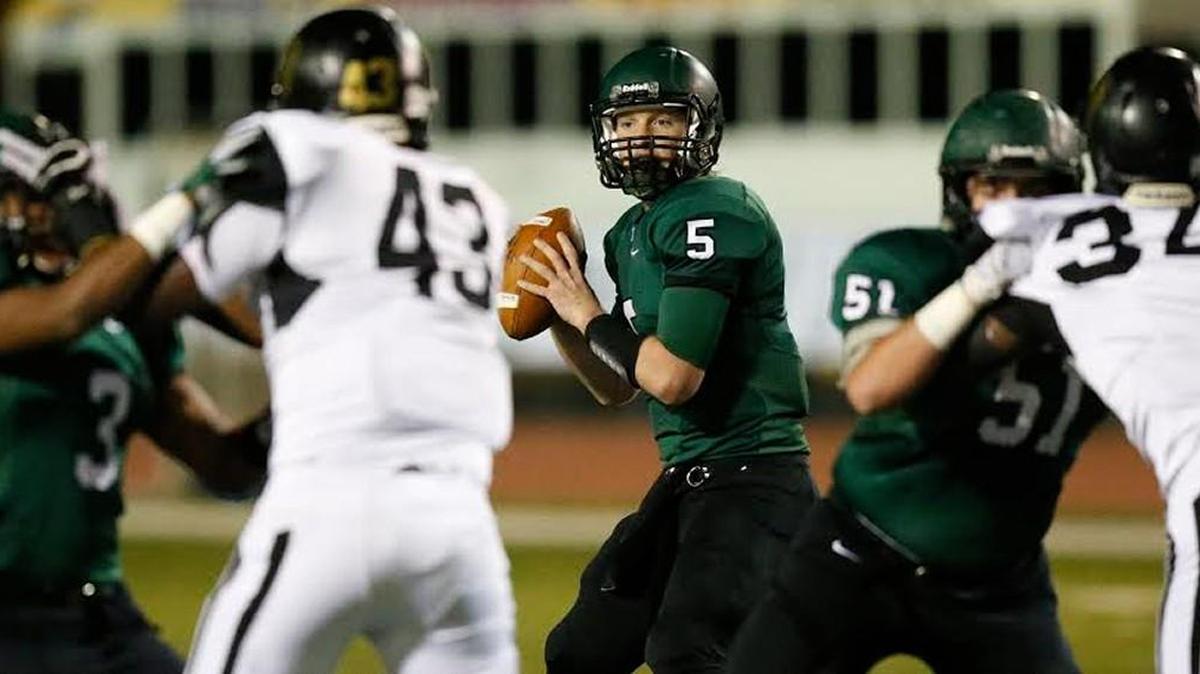 Derby quarterback Brady Rust looks for a receiver as Derby took on Topeka.