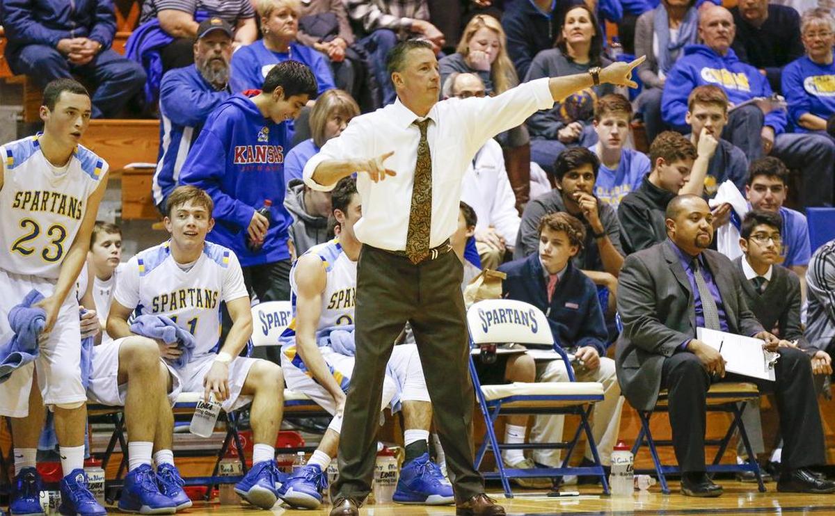 Collegiate coach Mitch Fiegel yells out instructions to his team during a 2016 game.