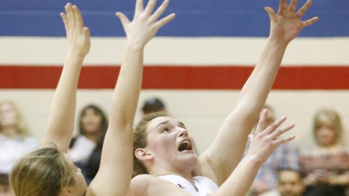 Cheney’s Kadie Smith (33) drives to the basket against Garden Plain's Taylor Joplin in the second quarter during their 33-31 win at Cheney High.
