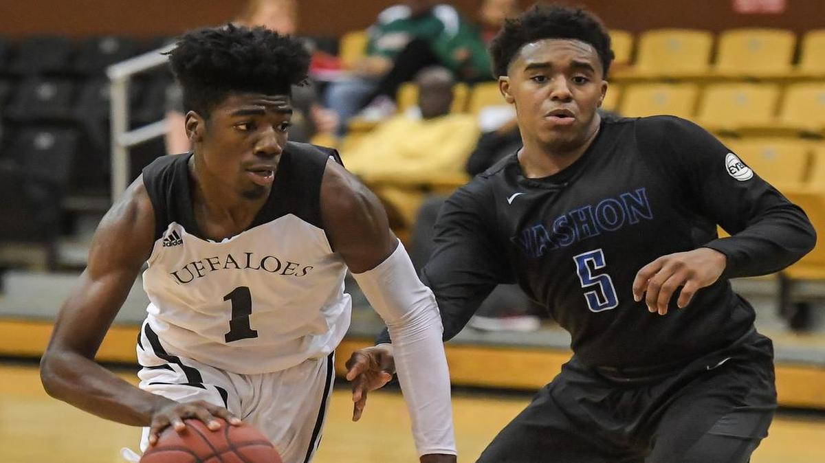 Southeast's Israel Barnes, left, drives past Vashon’s Daniel Farris.