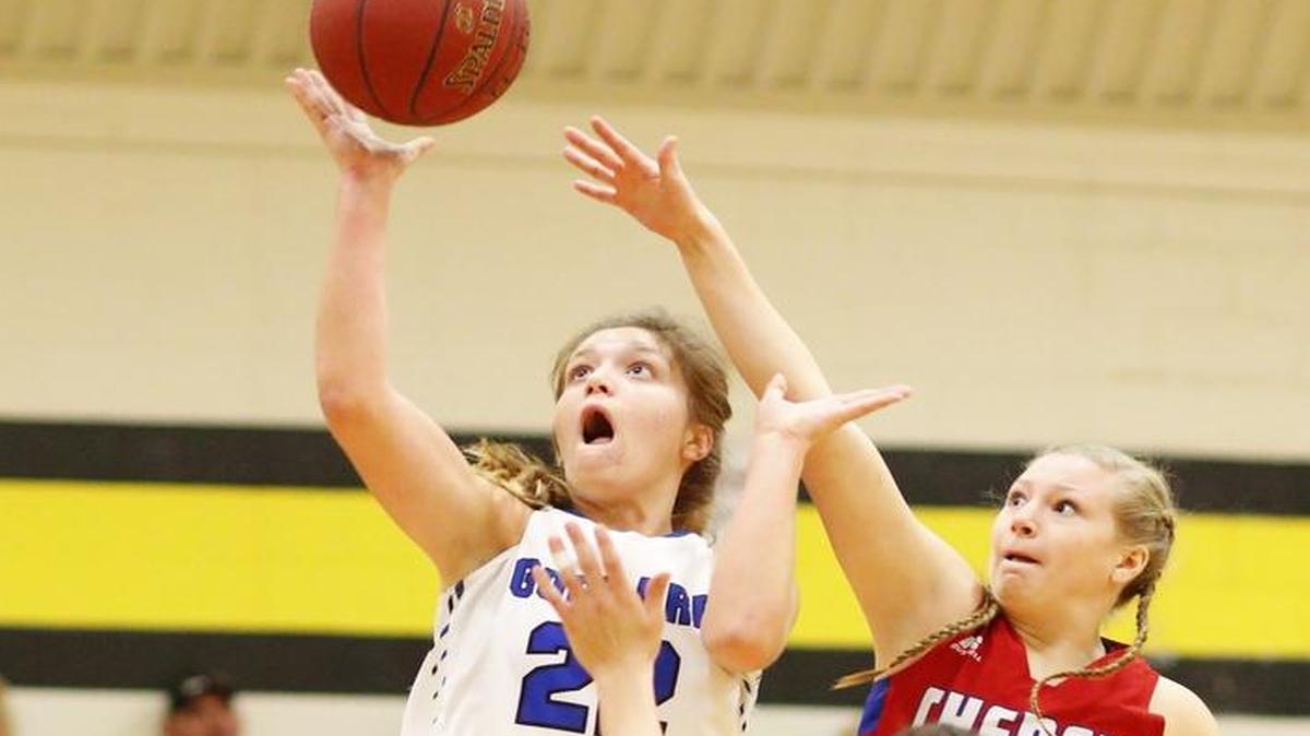 Goddard's C.J. Wilhelm, left, gets past Cheney’s Kennedy Higgins for a basket in the first quarter of Saturday’s Wildcat Classic final in Haven.