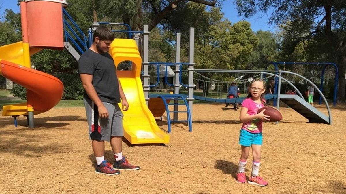 Sedgwick’s Marshall Rutschman and his 8-year-old cousin Gentry Ramsey play a game of catch.