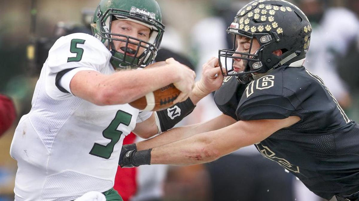 Derby’s Brady Rust is pushed out of bounds by Blue Valley's Jacob Watkins during the Class 6A championship game. Rust is the All-Class 6A quarterback.