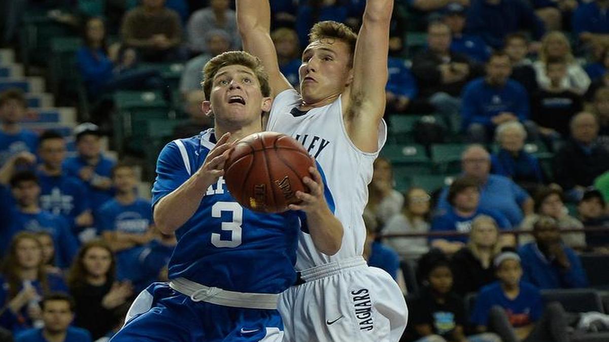 Kapaun’s Christopher Meitzner drives to the basket against Mill valley