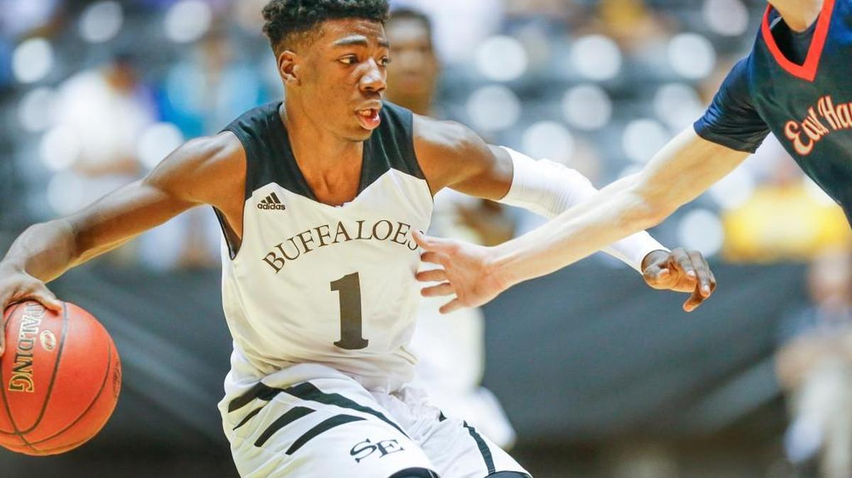 Southeast's Israel Barnes brings the ball up court against Olathe East during last year’s Class 6A tournament at Koch Arena.