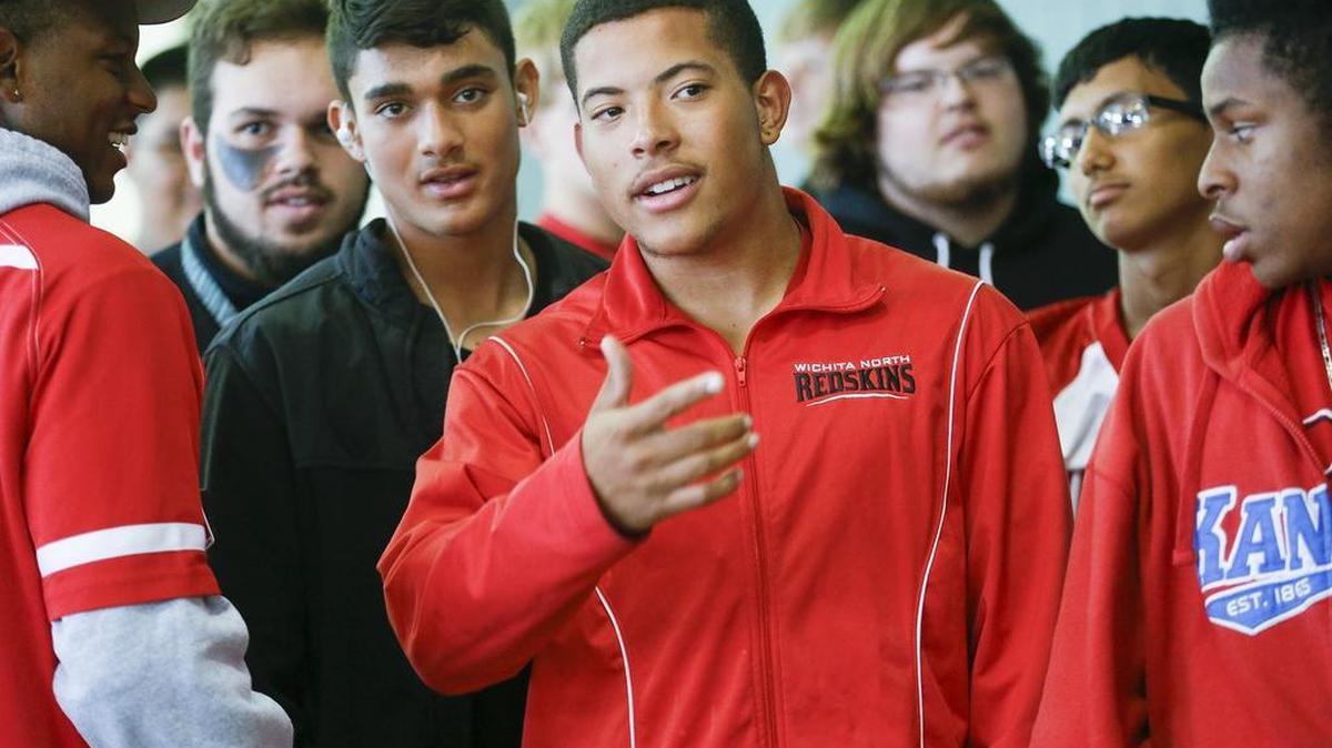 North running back Jose McDonald waits in line with his friends and teammates for the team meal before their game with Southeast on Thursday. He came from Puerto Rico hoping to play well enough to earn a college scholarship but has been sidetracked with injuries.