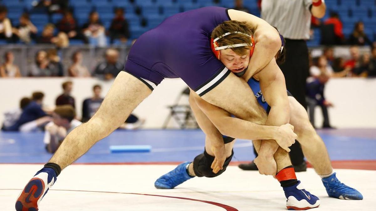 Goddard's Cale Davidson, right, wraps up the leg og Pittsburg's Dylan Prince in their 195-pound match at Hartman Arena.