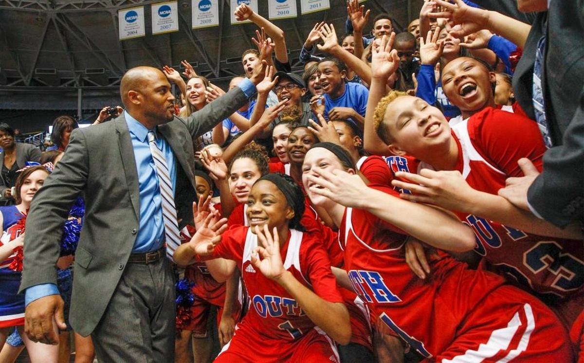 Antwain Scales and his players celebrate with fans after South’s 2015 Class 6A championship, the team’s third straight state title. Scales begins pursuit of his fifth straight on Thursday at Koch Arena.