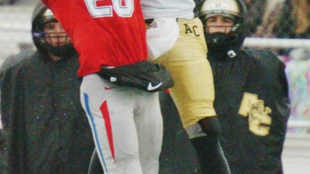 Bishop Miege's Cameron Key (28) breaks up a pass intended for Andover Central wide receiver Darraja Parnell Saturday afternoon, Nov. 28, 2015, during the Kansas State Class 4A Division I Championship game at Hummer Sports Complex in Topeka, Kan. Bishop Miege lead 48-6 at the end of the first half.