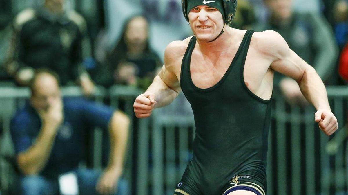 Maize South’s Luke Moore celebrates his victory over St. James’ Tyler Hensley in the 5A-152lb. semi-final at the State Championships at Hartman Arena on Friday.