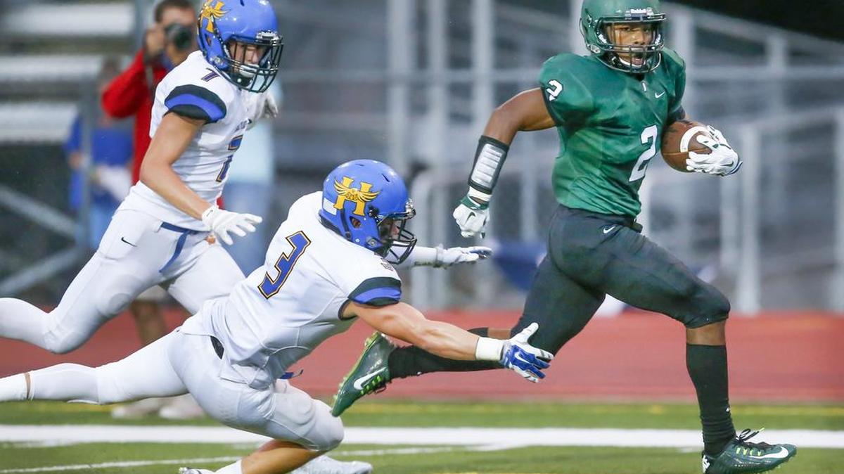 Derby wide receiver Kai Lemons (2) runs in for a touchdown after a reception against Hutchinson in the first quarter Friday at Derby.