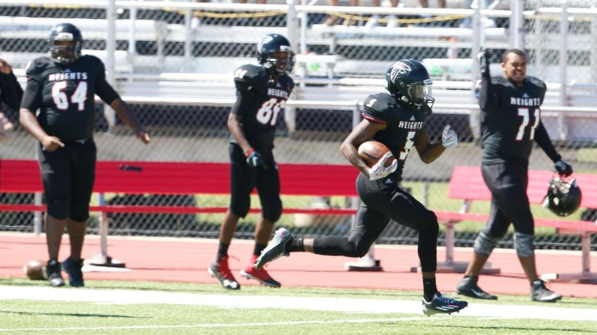 Heights running back Salani Williams sprints down the sideline Saturday on his way to a touchdown against Northwest.