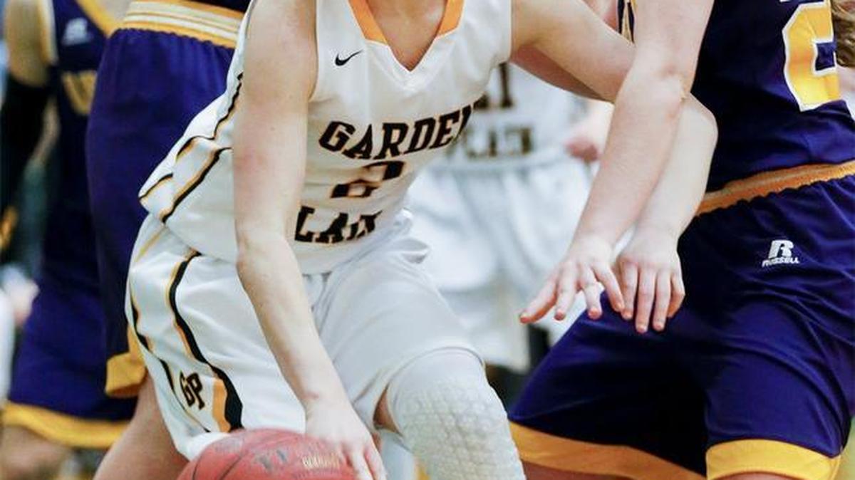 Garden Plain's Madi Schmelzer dribbles out of traffic in the fourth quarter against Arkansas City on Saturday in the Mulvane tournament final.